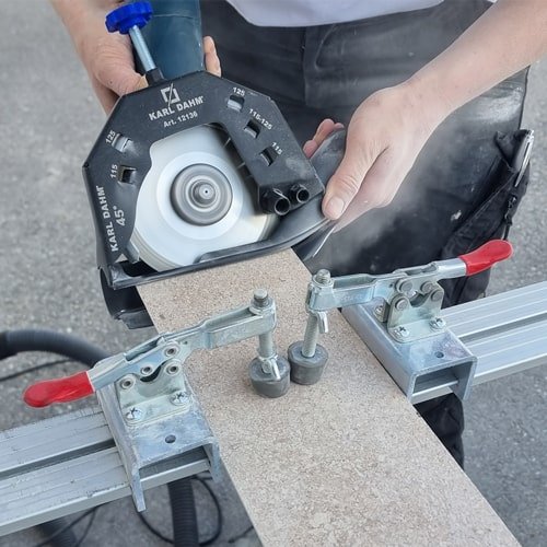 Angle grinder dust extractor for dust protection on the construction site