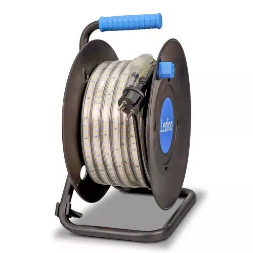 KARL DAHM LED strip light wound onto a black cable reel with blue carrying handle as seen from the front